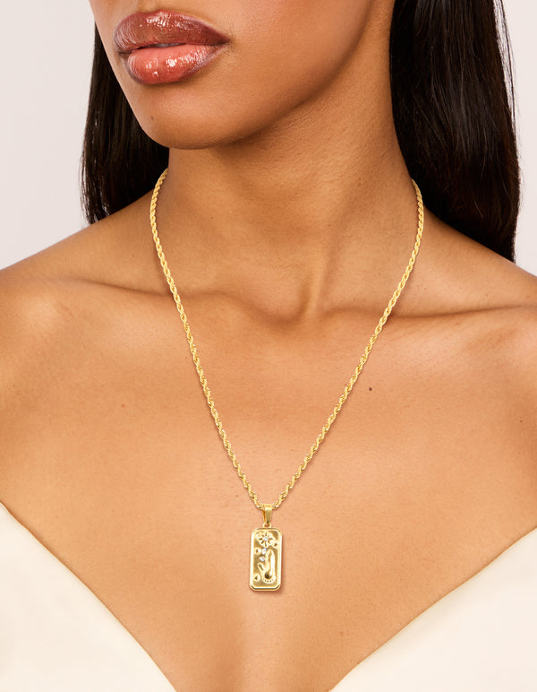 Featuring a celestial and floral pendant necklace crafted from waterproof gold plated stainless steel on neck view