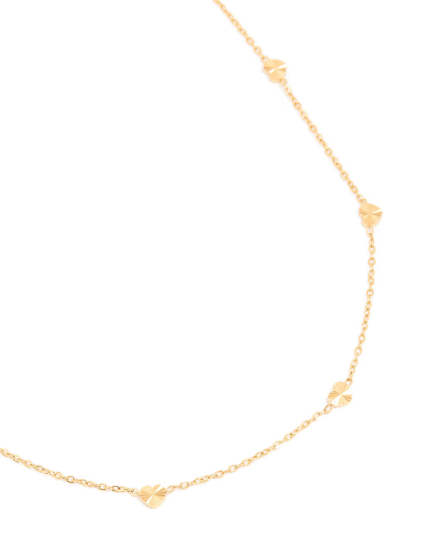 Elegant waterproof micro hearts necklace crafted from gold plated stainless steel with dainty design close up view
