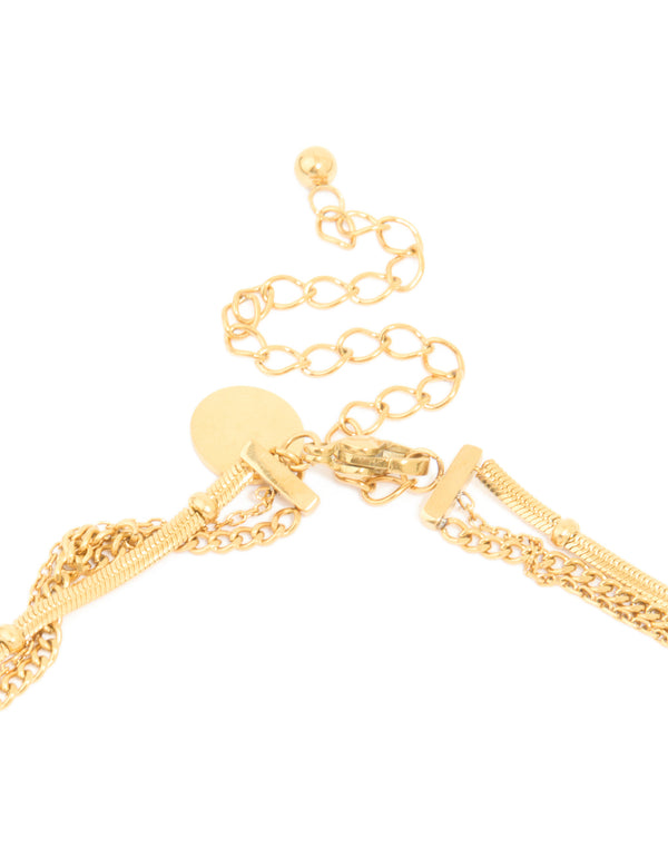 Highlighting the waterproof gold plated stainless steel layered necklace with celestial charm pendants featuring star, moon and balls clasp detail view