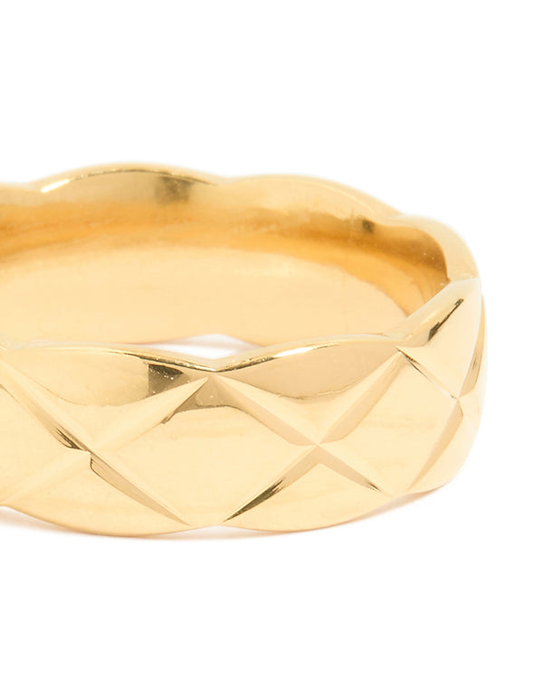 Highlighting a waterproof gold plated stainless steel crosshatch ring close up view