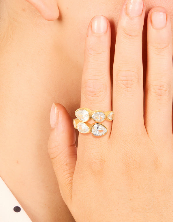 Discover how this waterproof wrap ring with pear cut cubic zirconia in a gold plated stainless steel setting looks worn on finger view
