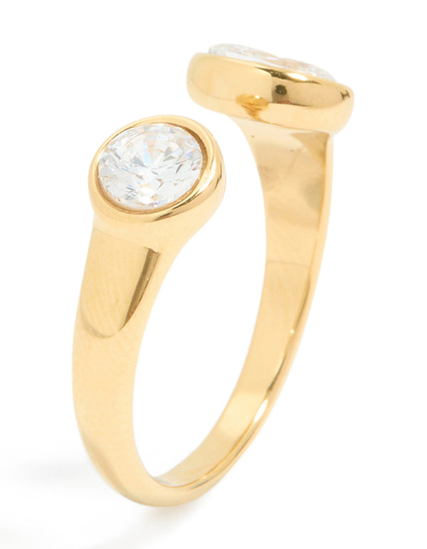 Highlighting a waterproof open ring in gold plated stainless steel with oval and round cubic zirconia featuring structural band details side detail view