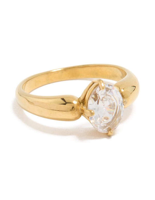 Showcasing a thick waterproof gold plated stainless steel ring with oval cut cubic zirconia in a statement style front view