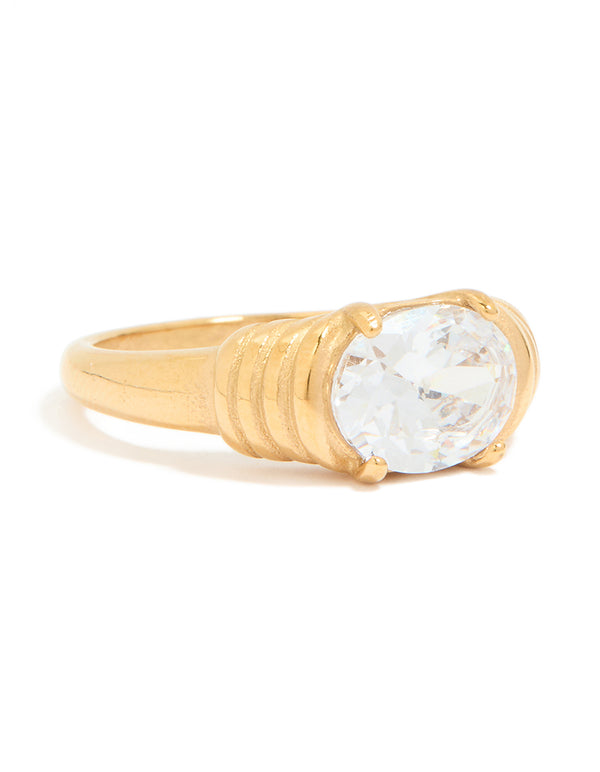 Featuring a waterproof gold plated stainless steel ribbed ring with oval cubic zirconia crystal front view