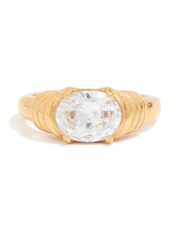 Presenting a waterproof gold plated stainless steel ribbed ring with oval cubic zirconia crystal close up view