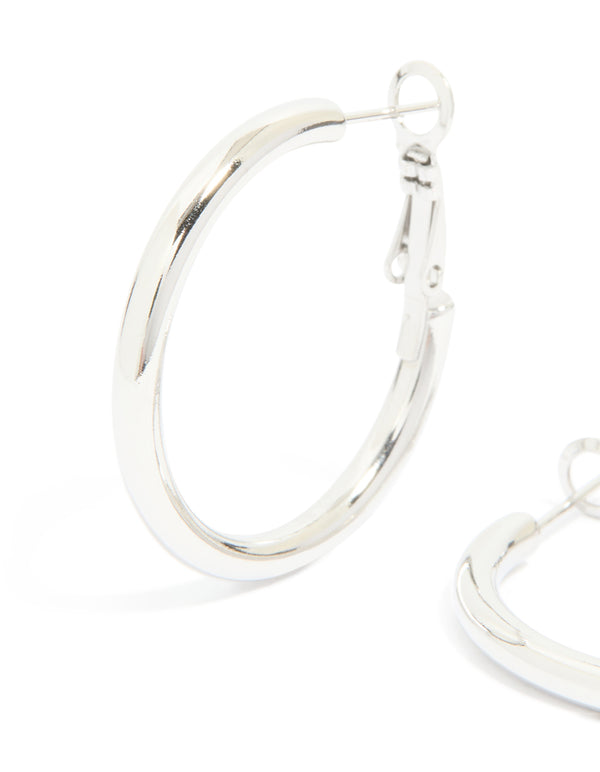 Featuring waterproof stainless steel, these hoop earrings deliver bold statement style in silver close up view