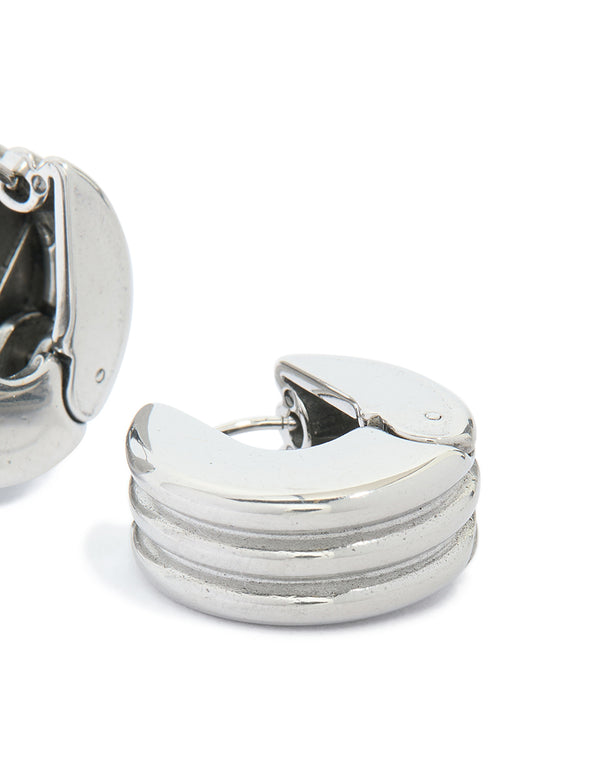 Designed with waterproof stainless steel ribbed circle hinged hoop earrings in silver post detail view