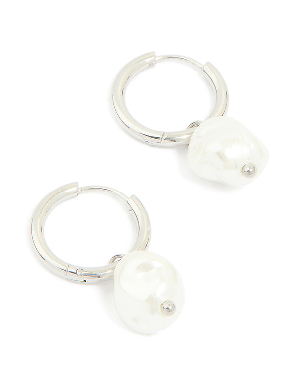 Elegant waterproof stainless steel pearl huggie earrings in white and silver front view