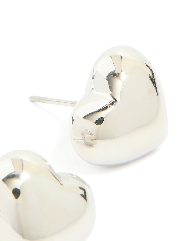 Highlighting small chunky heart stud earrings with waterproof stainless steel and silver post detail view