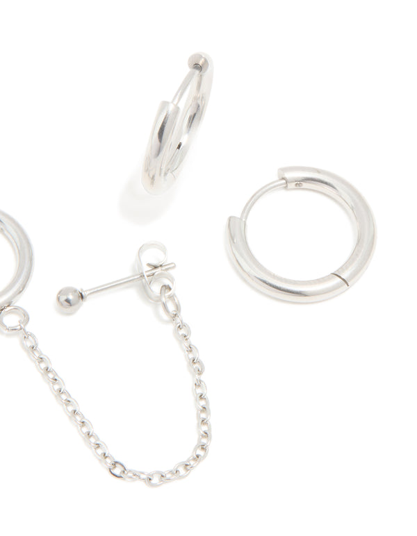 Crafted from waterproof stainless steel, these chain and huggie earrings in a 3-pack feature stud closure in silver finish post detail view