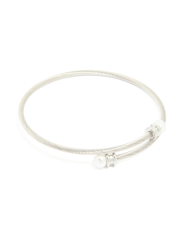 Featuring a waterproof stainless steel pearl twisted bangle in silver and white front view