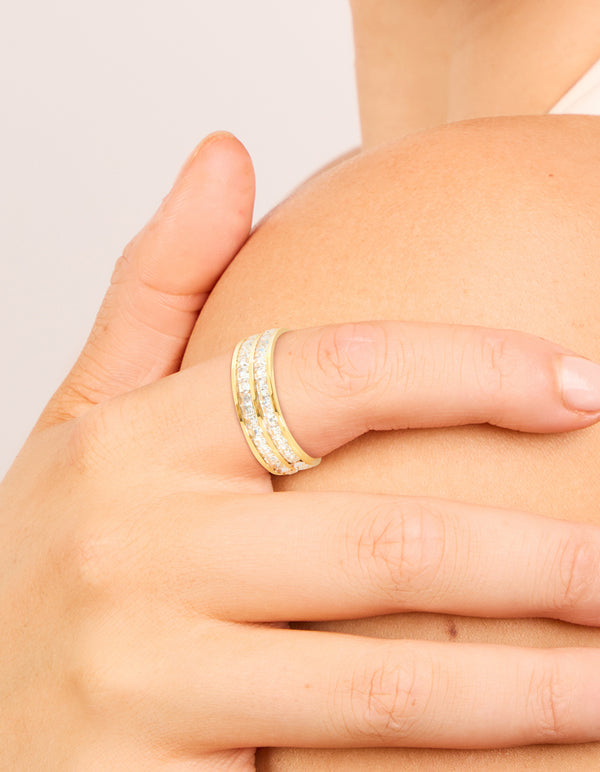 Featuring a waterproof gold plated stainless steel ring with square cubic zirconia in a double layered design on finger view