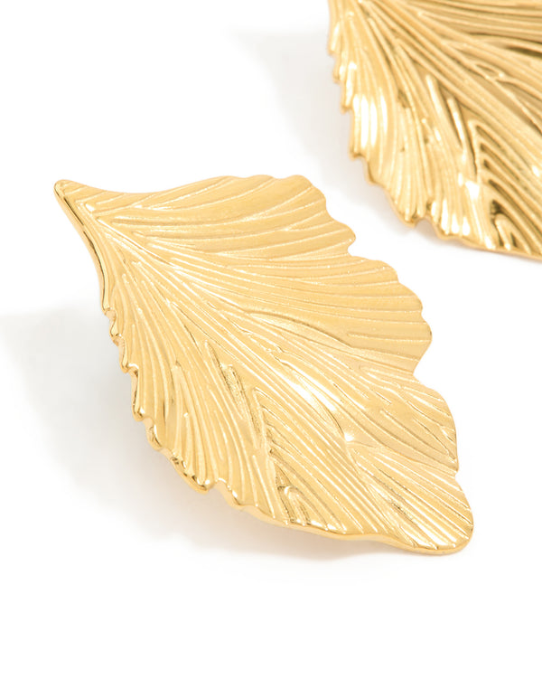 Highlighting waterproof gold plated stainless steel textured leaf earrings with intricate detailing close up view