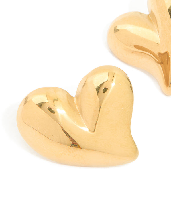 Discover these waterproof gold plated stainless steel moving heart statement stud earrings with polished finish close up view