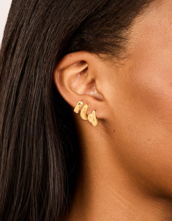 Featuring waterproof gold plated stainless steel chunky huggie earrings 3-pack on ear view