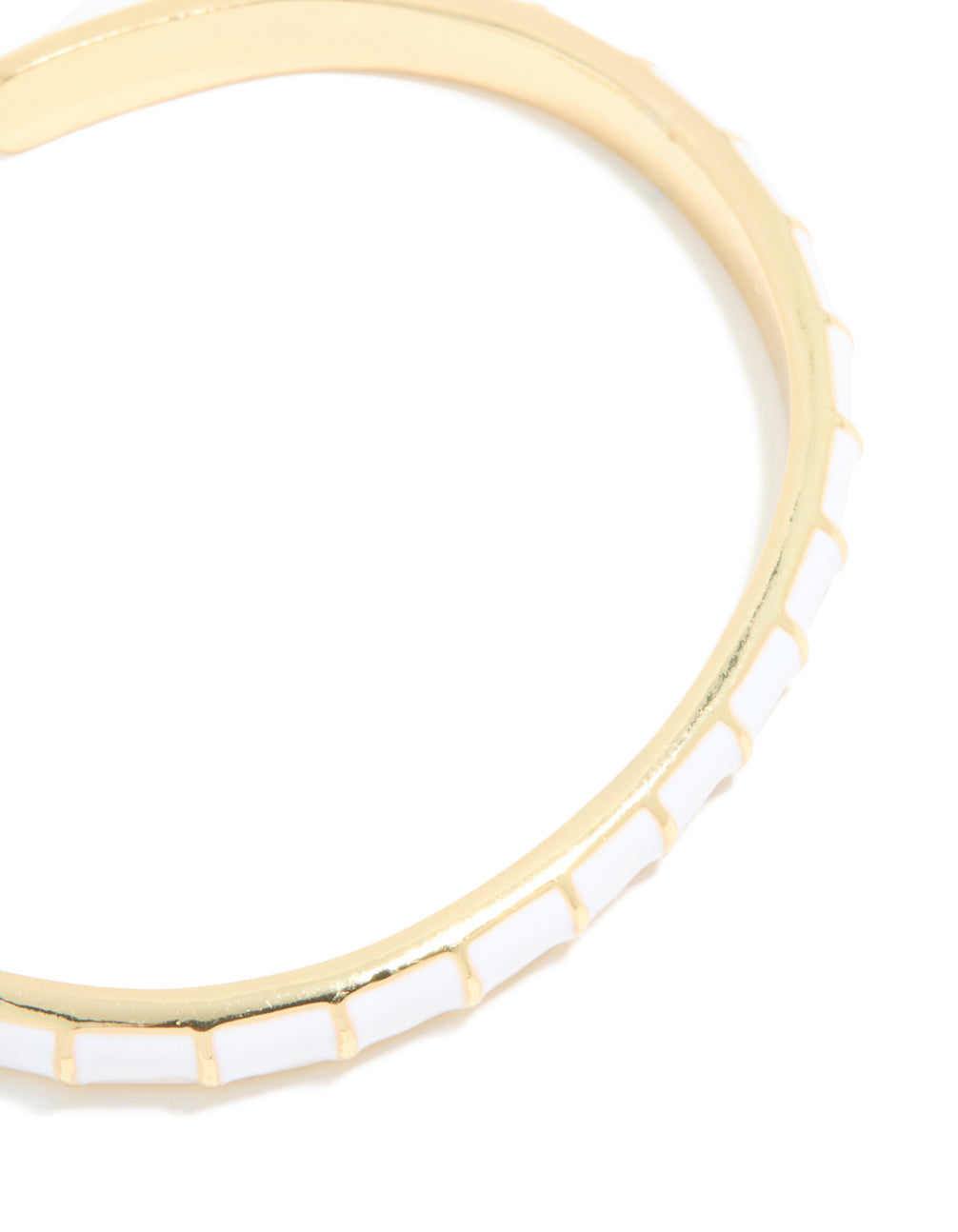 Presenting a waterproof bangle made of stainless steel featuring white enamel bamboo segments in gold plated close up view