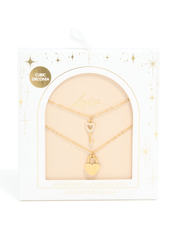 Showcasing a dainty waterproof heart padlock and key pendant layered necklace crafted from gold plated stainless steel close up view