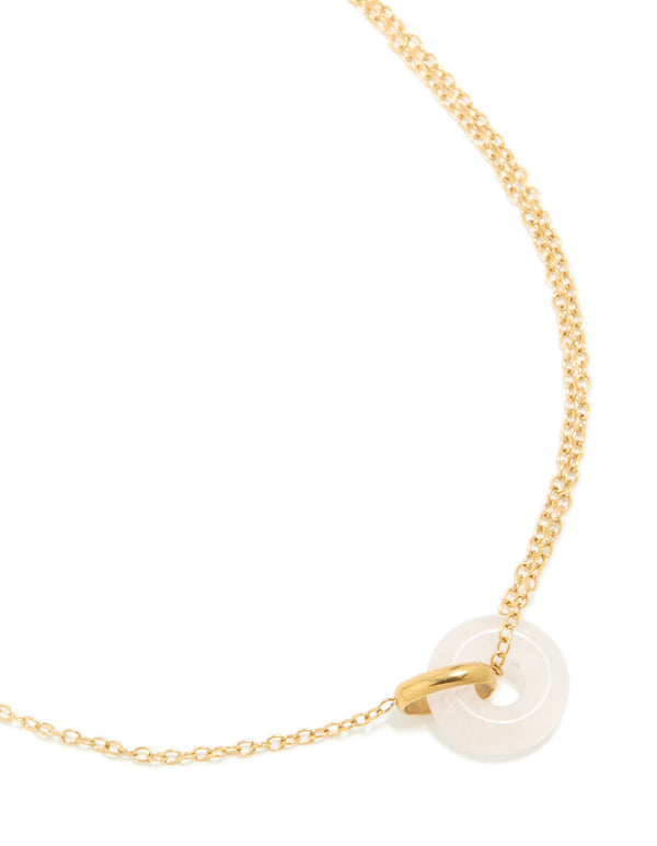 Featuring a waterproof acrylic pendant necklace in gold plated stainless steel with food-inspired doughnut design close up view