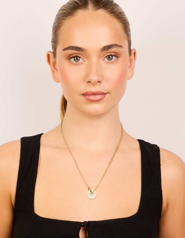Designed with waterproof gold plated stainless steel necklace, this acrylic pendant features food-inspired doughnut on model view
