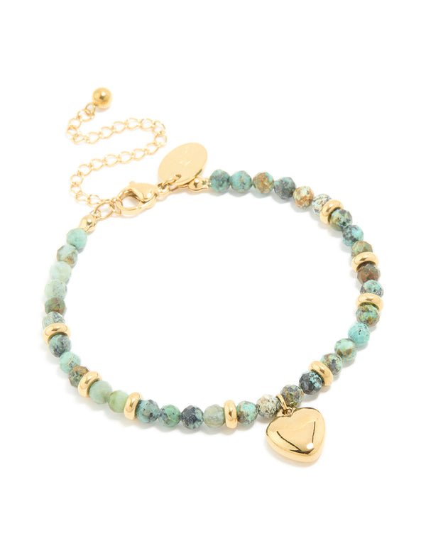 Displaying a waterproof beaded, heart bracelet crafted from turquoise semi precious stone with gold plated stainless steel and dainty style front view