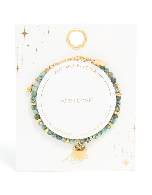 Highlighting a waterproof beaded, heart bracelet in turquoise semi precious stone with gold plated stainless steel and dainty design closure detail view