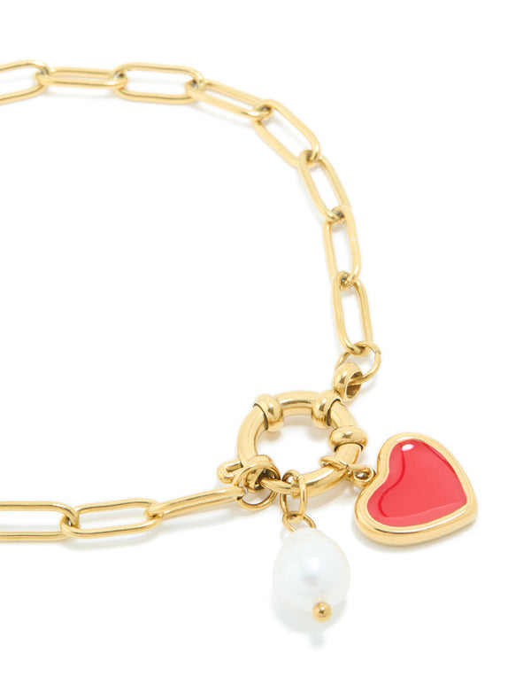 Highlighting the waterproof gold plated stainless steel bracelet with red enamel heart charm and pearl in dainty style close up view