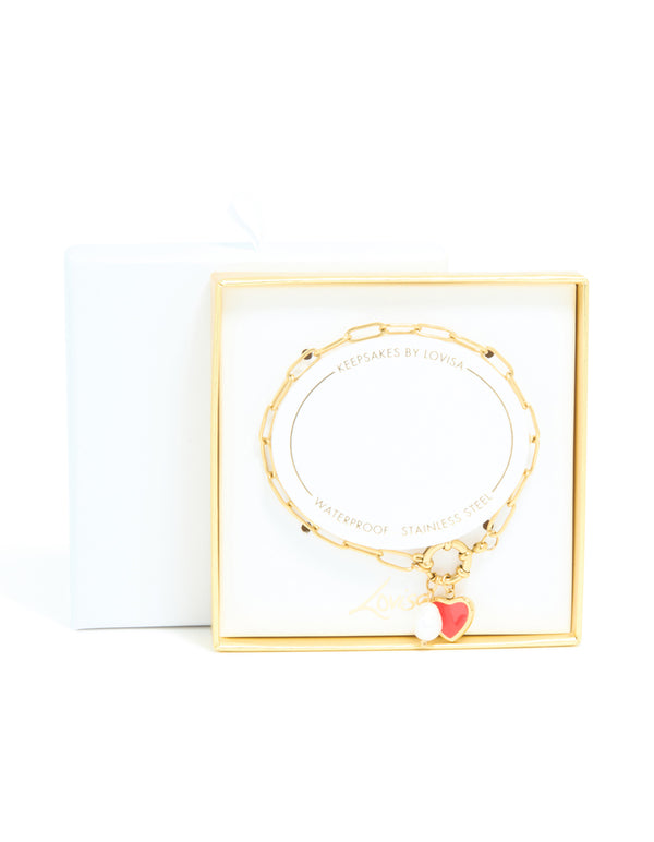 Beautifully packaged waterproof gold plated stainless steel bracelet with red enamel heart charm and pearl in dainty style closure detail view