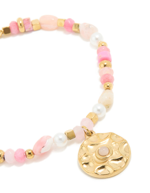 Detailed view of the waterproof celestial coin beaded bracelet highlighting rose quartz, pearl gemstones, and gold plated stainless steel craftsmanship in close up view