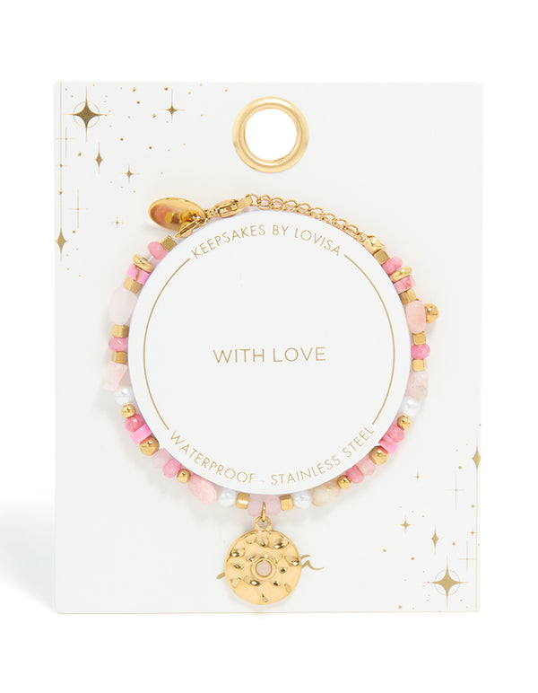 Waterproof celestial coin beaded bracelet with rose quartz and pearl, crafted from gold plated stainless steel, displayed on keepsake card closure detail view