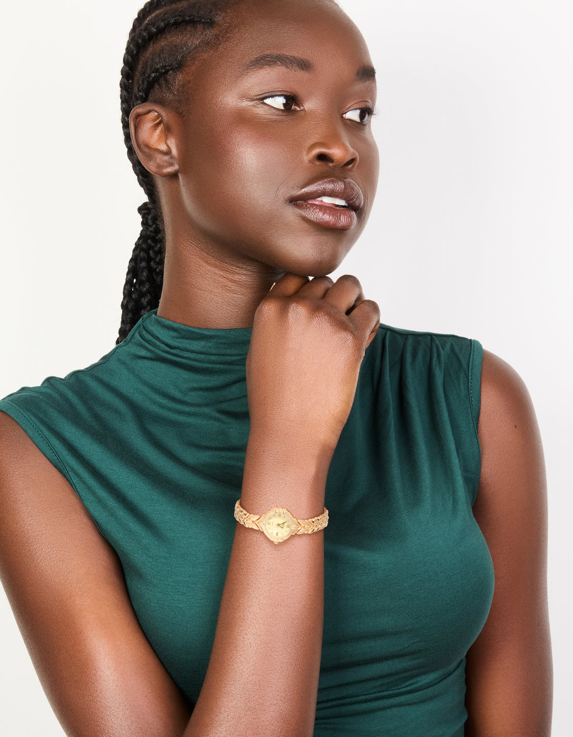 Featuring a vintage watch with leaf detailing, gold dial showcasing Roman numerals in a round shape, designed for women's casual occasions with link-band strap in gold and analog type on model view