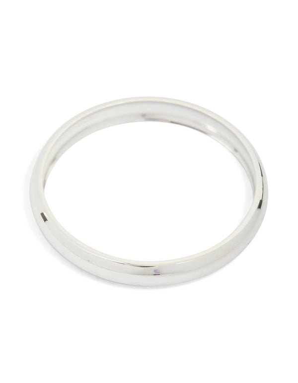 Showcasing a waterproof stainless steel round smooth bangle crafted from silver front view