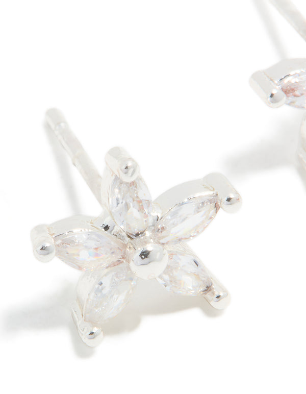 Highlighting waterproof stainless steel cubic zirconia five-petal flower stud earrings in silver and clear close up view