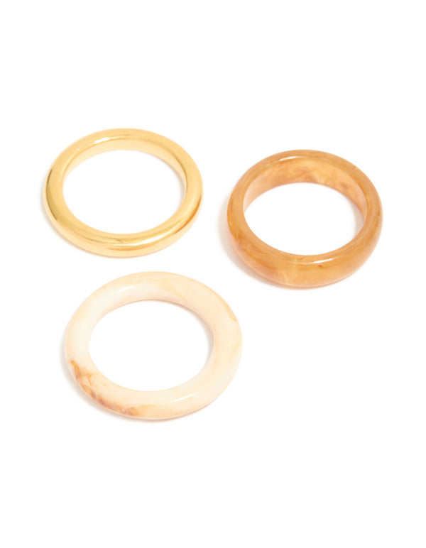 Featuring waterproof gold plated stainless steel and marbled stacking rings in a 3-pack front view