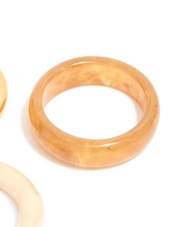 Crafted from waterproof gold plated stainless steel with marbled accents as stacking rings in a 3-pack side detail view