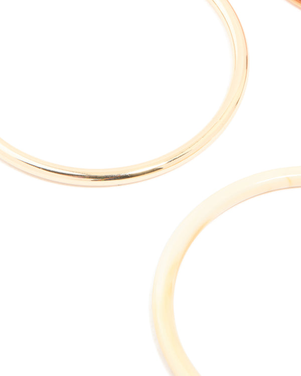 Featuring mixed acrylic bangles 4-pack in gold close up view