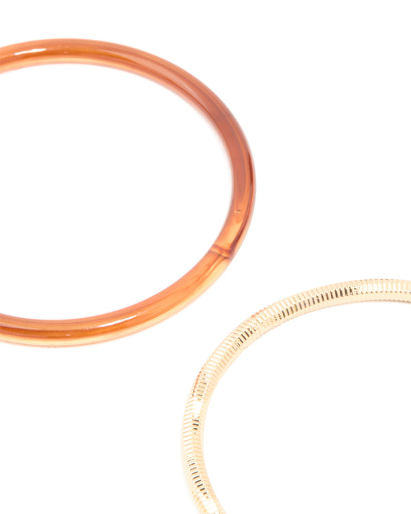 Featuring mixed acrylic bangles 4-pack in gold close up view