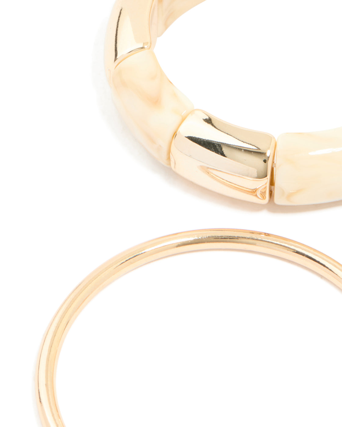 Designed with cream acrylic stretch bangle and bangles in a 3-pack close up view