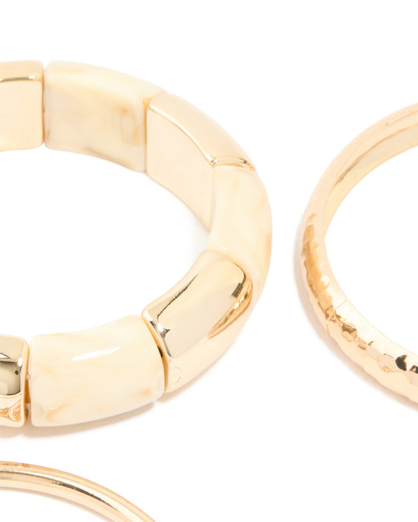 Highlighting cream acrylic stretch bangle and bangles in a 3-pack closure detail view