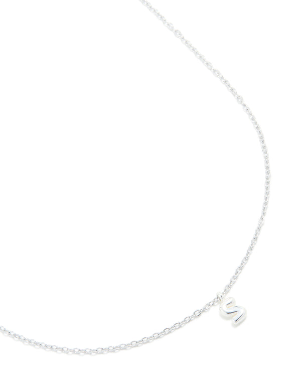 Crafted from waterproof stainless steel with initial bubble letter S in silver, this dainty necklace features a close up view
