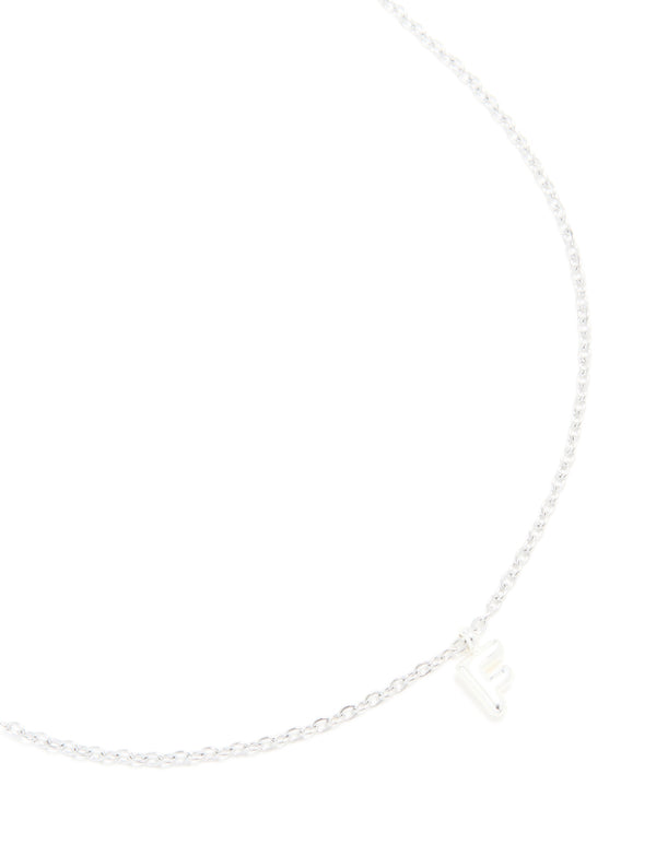Showcasing a waterproof stainless steel mini bubble letter F initial pendant necklace in silver close up view