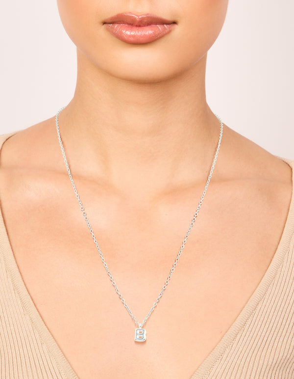 Featuring a waterproof stainless steel mini bubble letter B necklace with initial on neck view