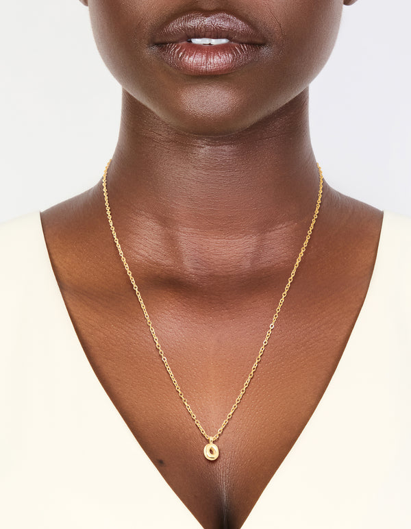 Designed with waterproof gold plated stainless steel and mini bubble letter O initial pendant necklace on neck view