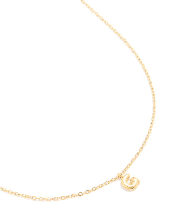 Showcasing a waterproof bubble letter G necklace crafted from gold plated stainless steel with featuring initial pendant front view