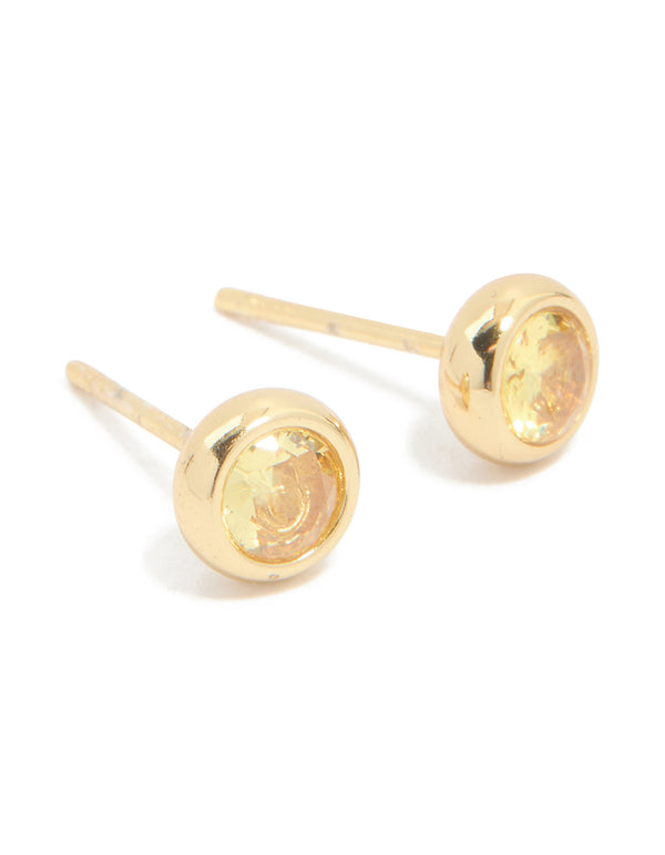 Showcasing waterproof bezel set stud earrings featuring cubic zirconia November birthstone in gold plated stainless steel front view