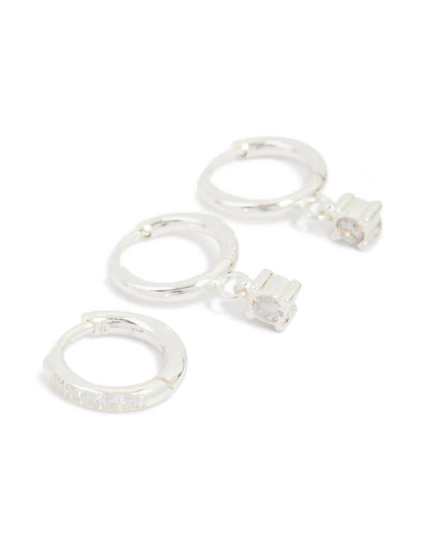 Featuring waterproof stainless steel diamante stud and huggie earrings in a 3-pack in silver and clear post detail view