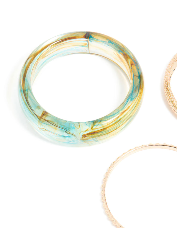 Showcasing marble pattern bangles in gold and light blue in a 3-pack close up view