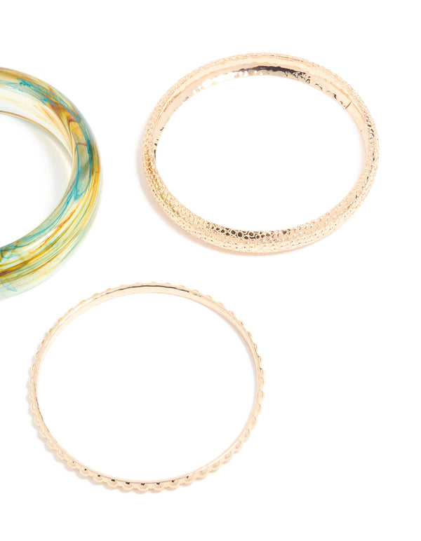 Showcasing marble pattern bangles in gold and light blue in a 3-pack close up view