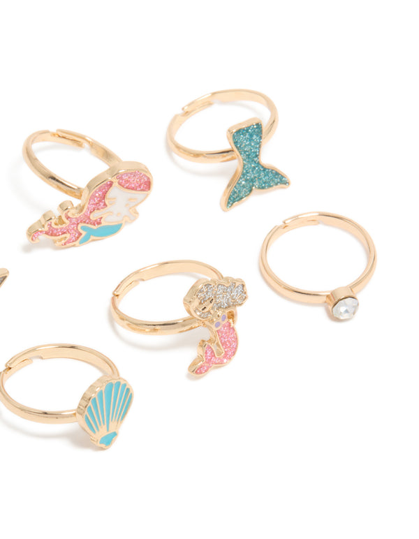 Crafted kids celestial, glitter, ocean and shell old turquoise and pink rings side detail view