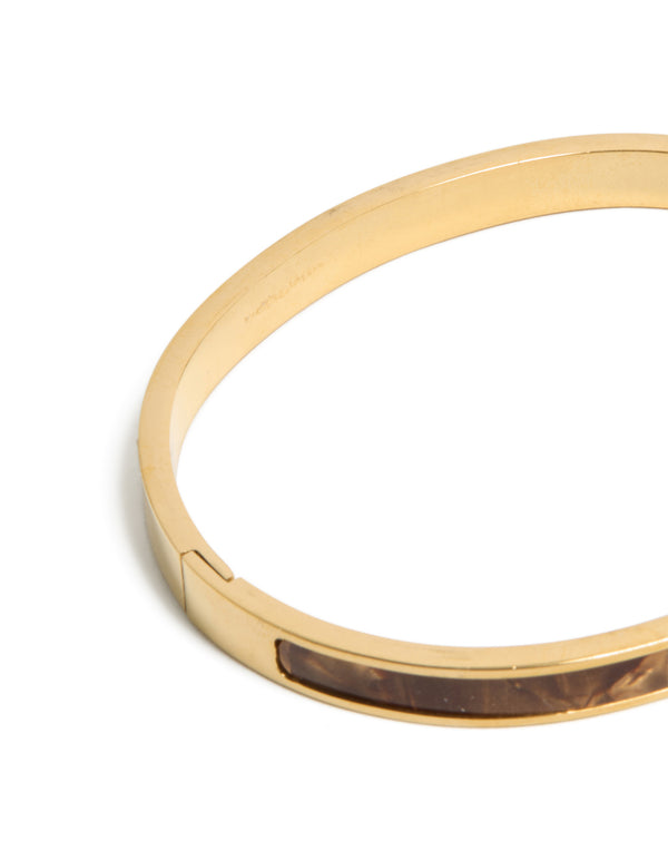 Crafted from waterproof gold plated stainless steel hinged bangle featuring brown pearlised inlay in closure detail view