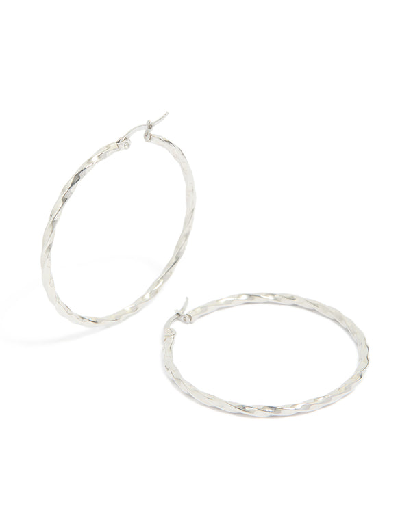 Showcasing surgical steel textured hoop earrings in 40 MM with silver closure front view